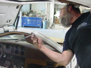 Car Restoration 1974 Bricklin - Larry installing door